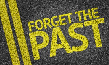 Forget the past written on the road clipart