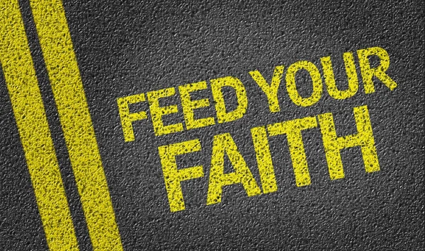 Feed your Faith written on the road — Stock Photo, Image