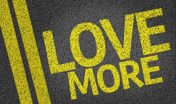 Love More written on the road — Stock Photo, Image