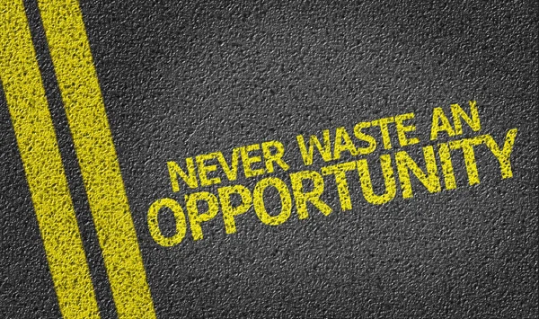 Never Waste An Opportunity! written on the road — Stock Photo, Image