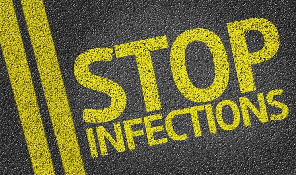 Stop Infections written on the road — Stock Photo, Image