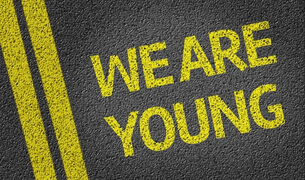 We are Young written on the road — Stock Photo, Image