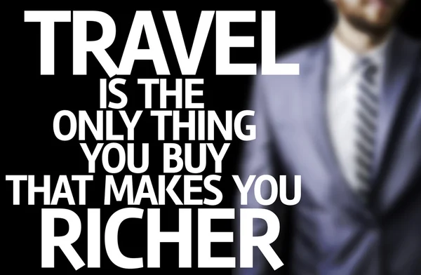 Travel is The Only Thing you Buy That Makes you Richer written on a board with a business man — Stock Photo, Image