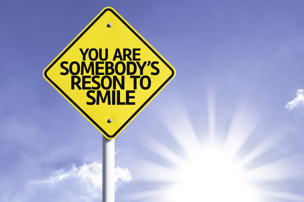 You Are Somebody's Reason to Smile road sign