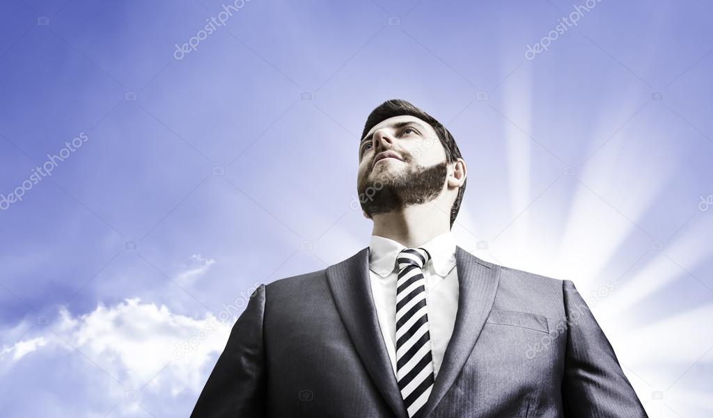 Business man on sky background