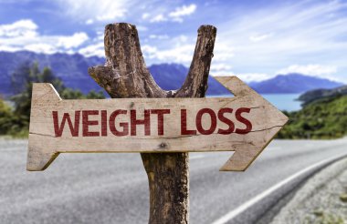 Weight Loss wooden sign with a landscape background clipart
