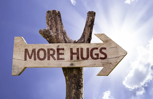 More  Hugs       wooden sign — Stock Photo, Image