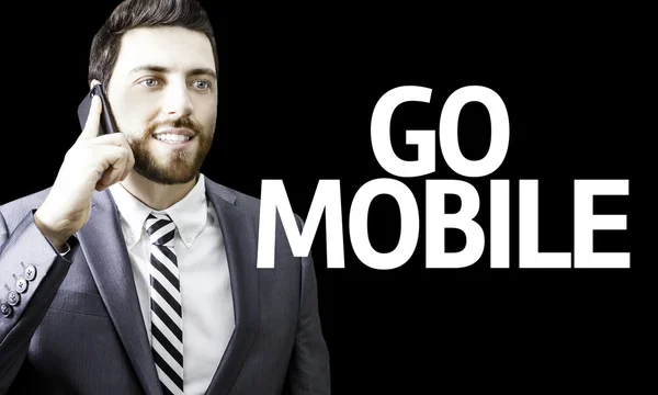 Business man with the text Go Mobile in a concept image — Stock Photo, Image