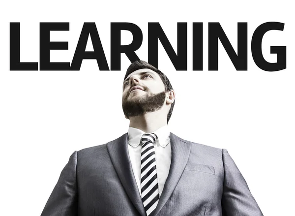 Business man with the text Learning in a concept image — Stock Photo, Image