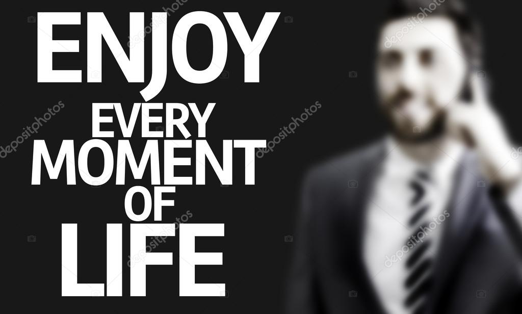 Business man with the text Enjoy Every Moment of Life in a concept image