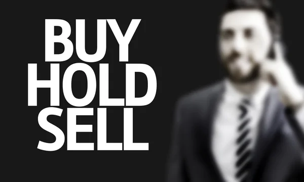 Hombre de negocios con el texto Comprar Hold Vender en una imagen conceptual —  Fotos de Stock