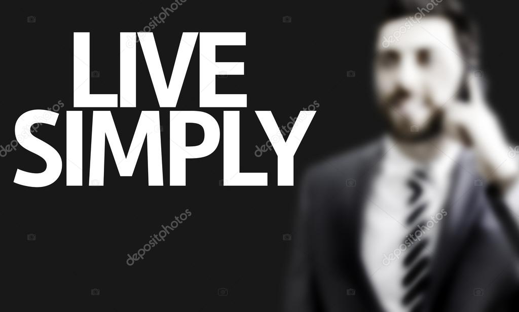 Business man with the text Live Simply in a concept image