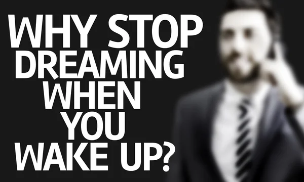 Business man with the text Why Stop Dreaming When You Wake Up? in a concept image — Stock Photo, Image