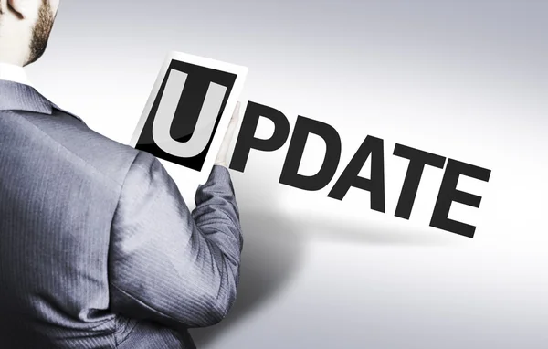 Business man with the text Update in a concept image — Stock Photo, Image