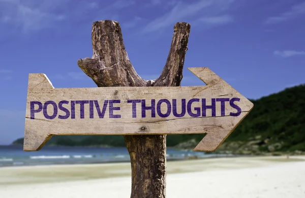 Positive Thoughts wooden sign with a beach on background — Stock Photo, Image