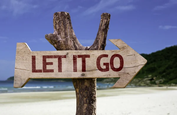 Let It Go wooden sign with a beach on background — Stock Photo, Image