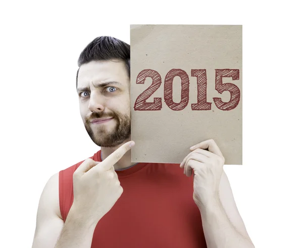 Hombre sosteniendo una tarjeta con el texto 2015 — Foto de Stock