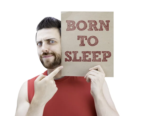 Man holding a card with the text Born to Sleep — Stock Photo, Image