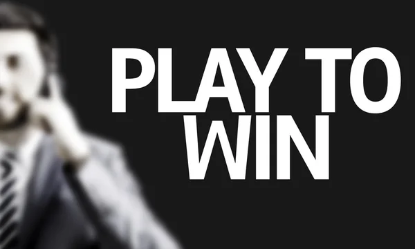Деловой человек с текстом Play to Win — стоковое фото