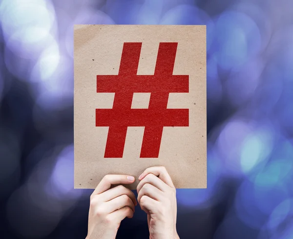 Ícone Hashtag escrito sobre fundo colorido — Fotografia de Stock