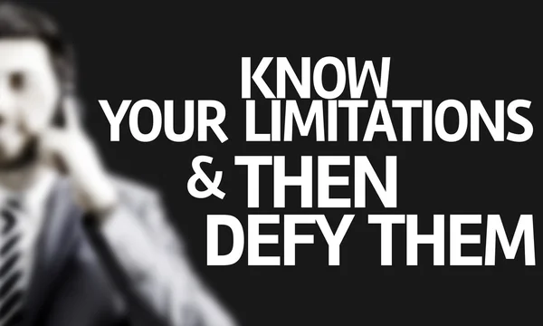 Business man with the text Know Your Limitations & Then Defy Them — Stock Photo, Image