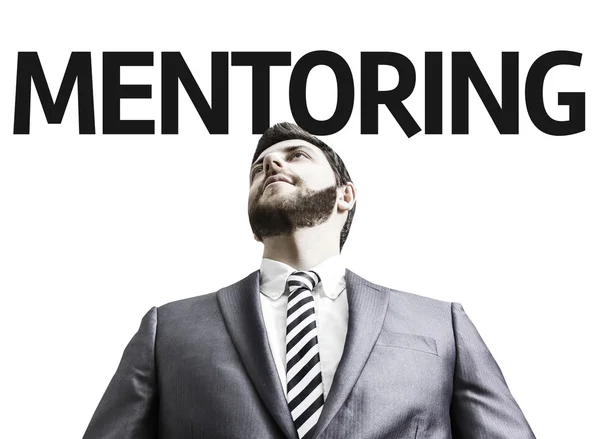 Uomo d'affari con il testo Mentoring — Foto Stock