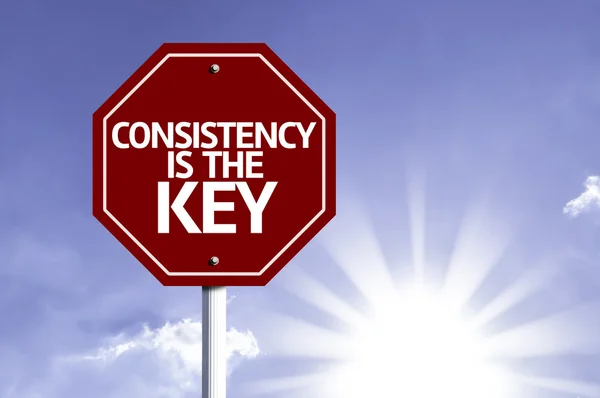 Consistency is The Key written on red road sign — Stock Photo, Image