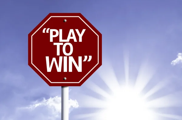 "Play to win "napisane na czerwonym znaku drogowego — Zdjęcie stockowe