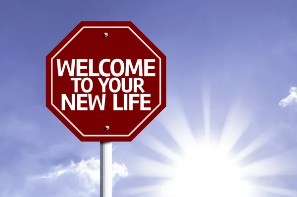 Welcome To Your New Life written on red road sign — Stock Photo, Image