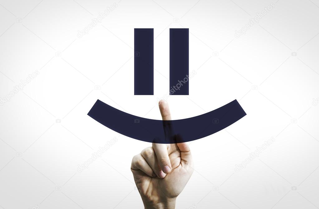 Hand Pointing in a Transparent Board a Smiley