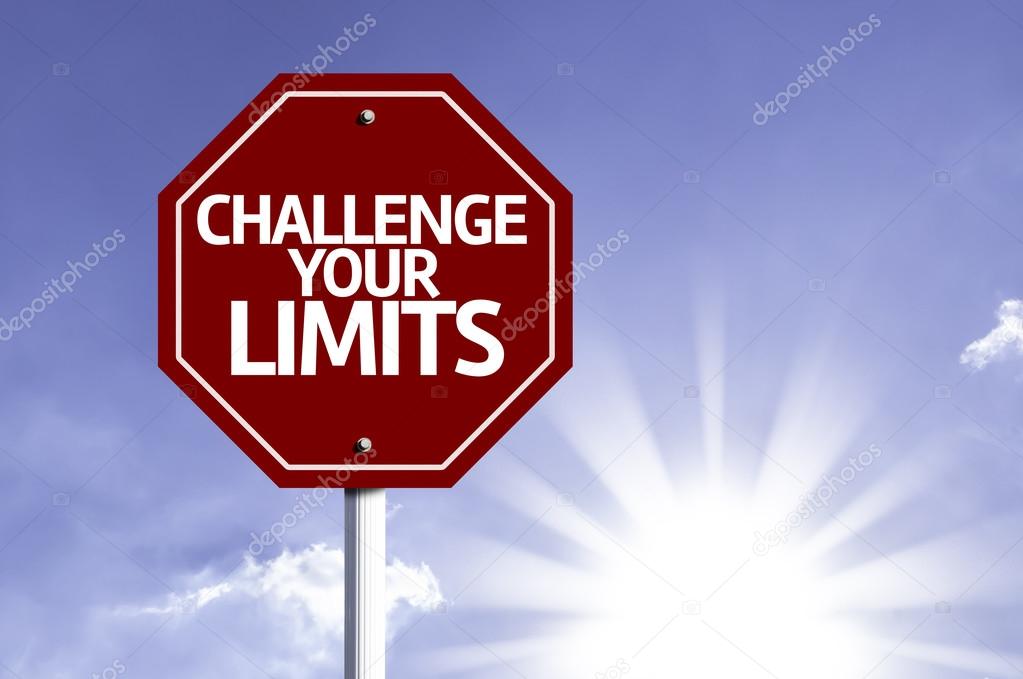 Challenge your Limits written on red road sign