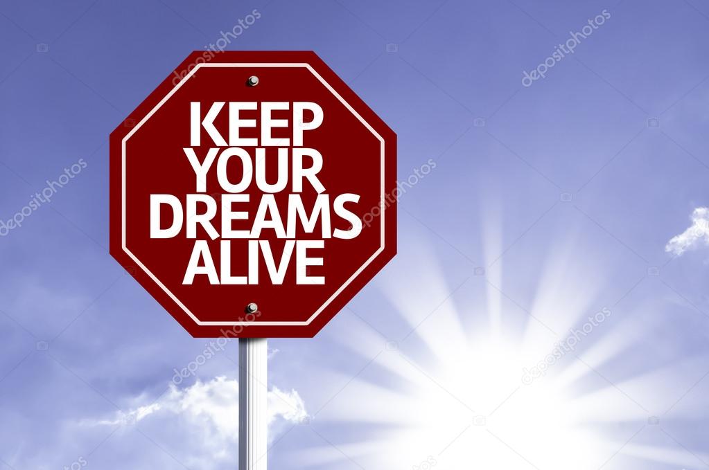 Keep Your Dreams Alive written on red road sign