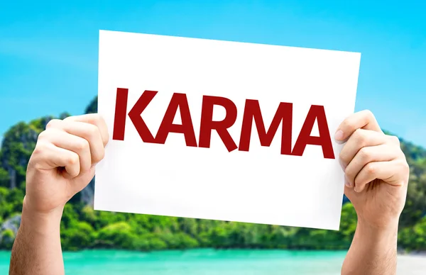 Karma kaart in handen — Stockfoto