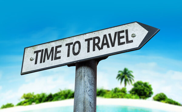 Time to Travel sign with a beach on background