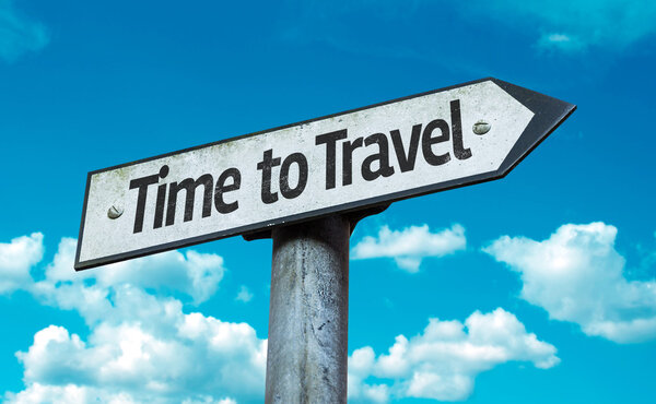 Time to Travel sign with sky background