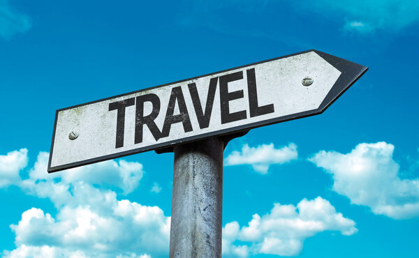 Travel sign with sky background