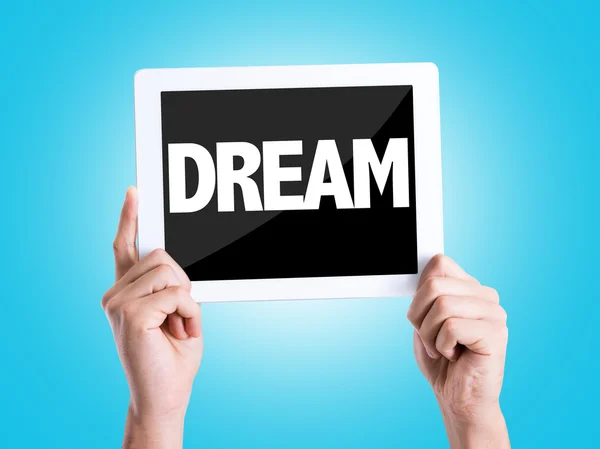 Tablet pc with text Dream — Stock Photo, Image