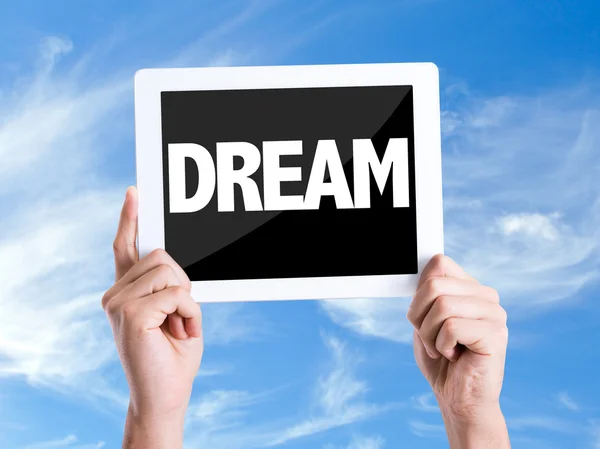 Tablet pc with text Dream — Stock Photo, Image