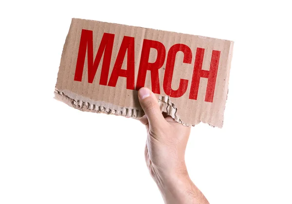 Cartão de março na mão — Fotografia de Stock