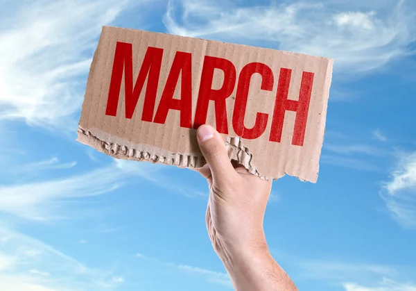 Cartão de março na mão — Fotografia de Stock
