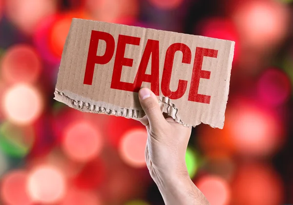 Cartão de paz na mão — Fotografia de Stock