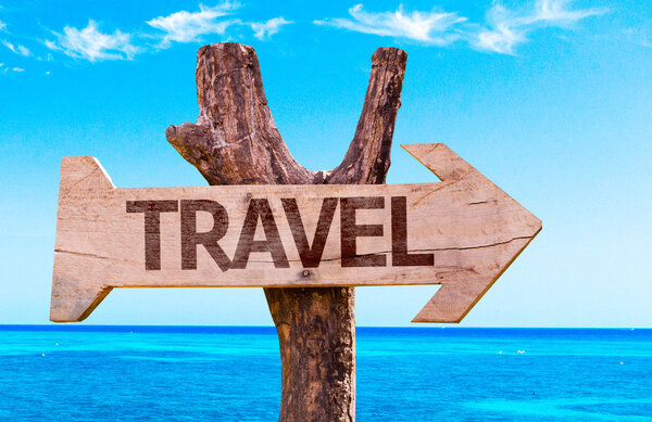 Travel wooden sign with arrow