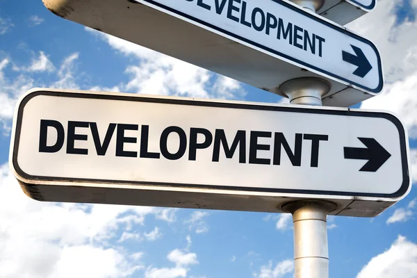 Signo de direção de desenvolvimento — Fotografia de Stock
