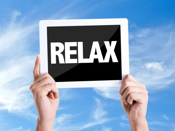 Tablet pc with text Relax — Stock Photo, Image