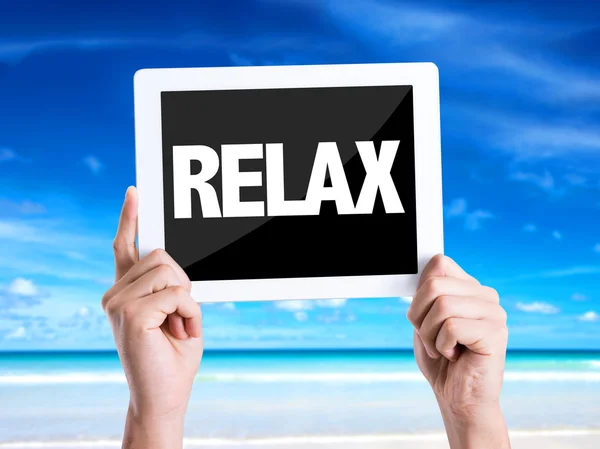 Tablet pc with text Relax — Stock Photo, Image