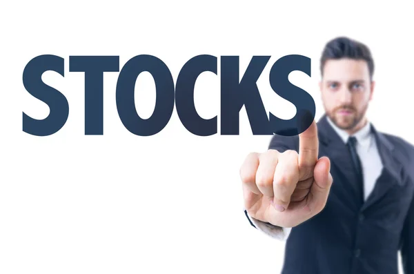 Business man with text: Stocks — Stock Photo, Image