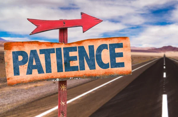 Patience sign with road background — Stock Photo, Image