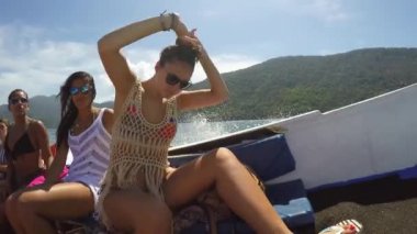 Friends enjoy the travel on Sailboat