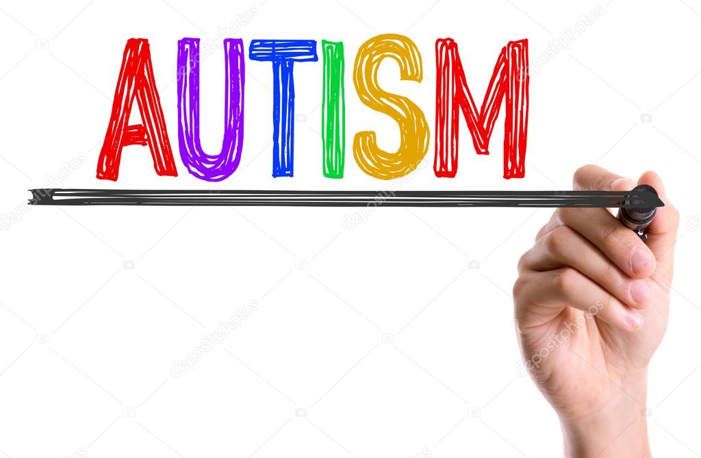 Hand writting the word Autism