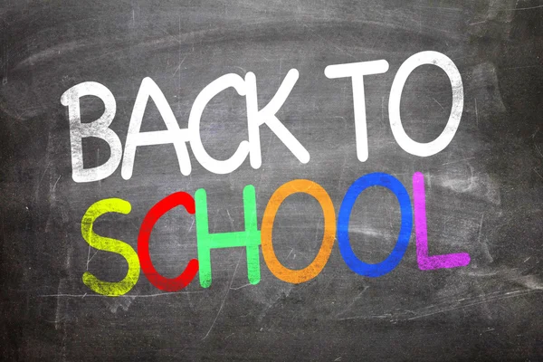 Back to school written on a chalkboard — Stock Photo, Image